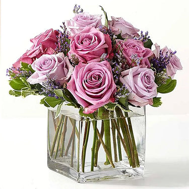 Purple Roses in Glass Vase